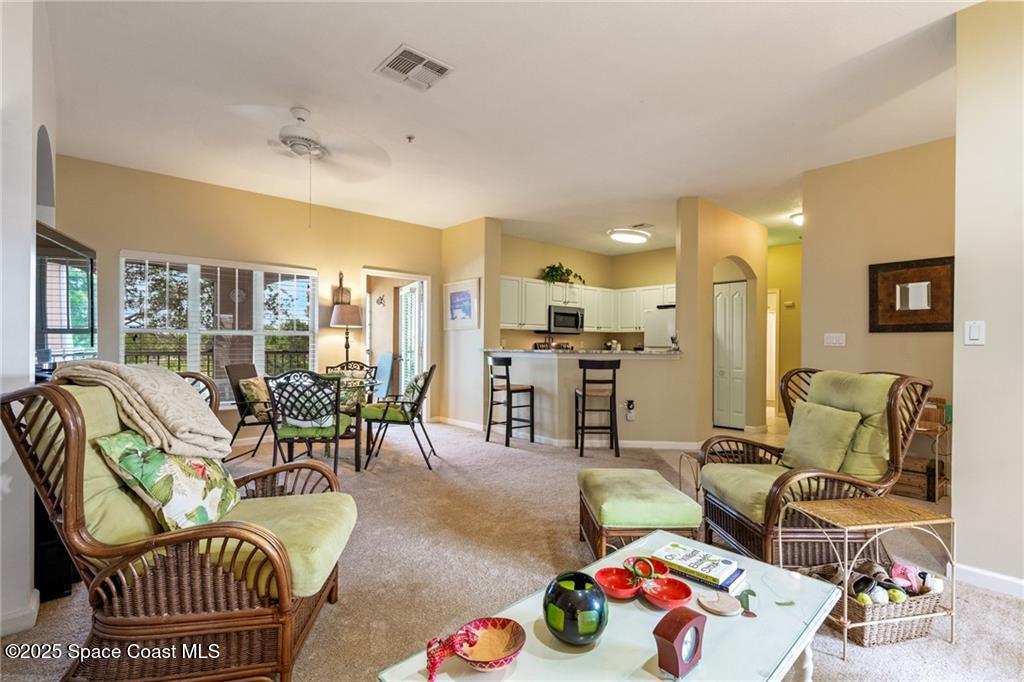 Undisclosed Address Vero Beach, FL 32967 - Photo 7 of 34 a living room with furniture and a table
