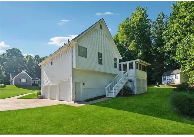 a living room with fireplace furniture and a flat screen tv