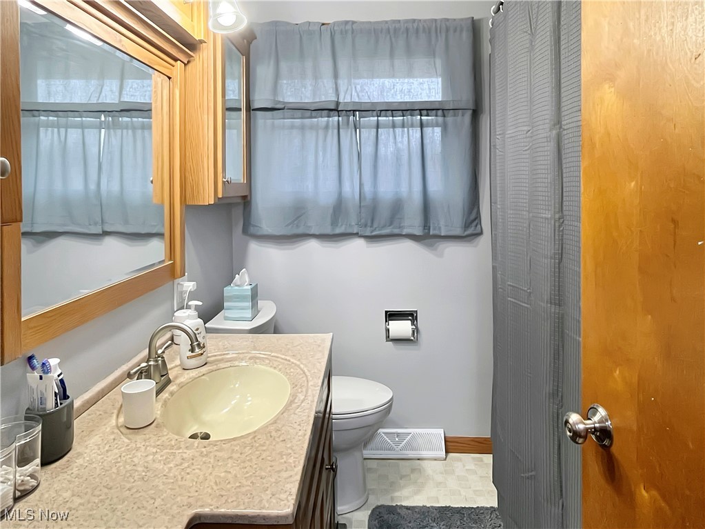 3968 Cannon Road Youngstown, OH 44515 - Photo 14 of 25 Bathroom featuring vanity and light floors