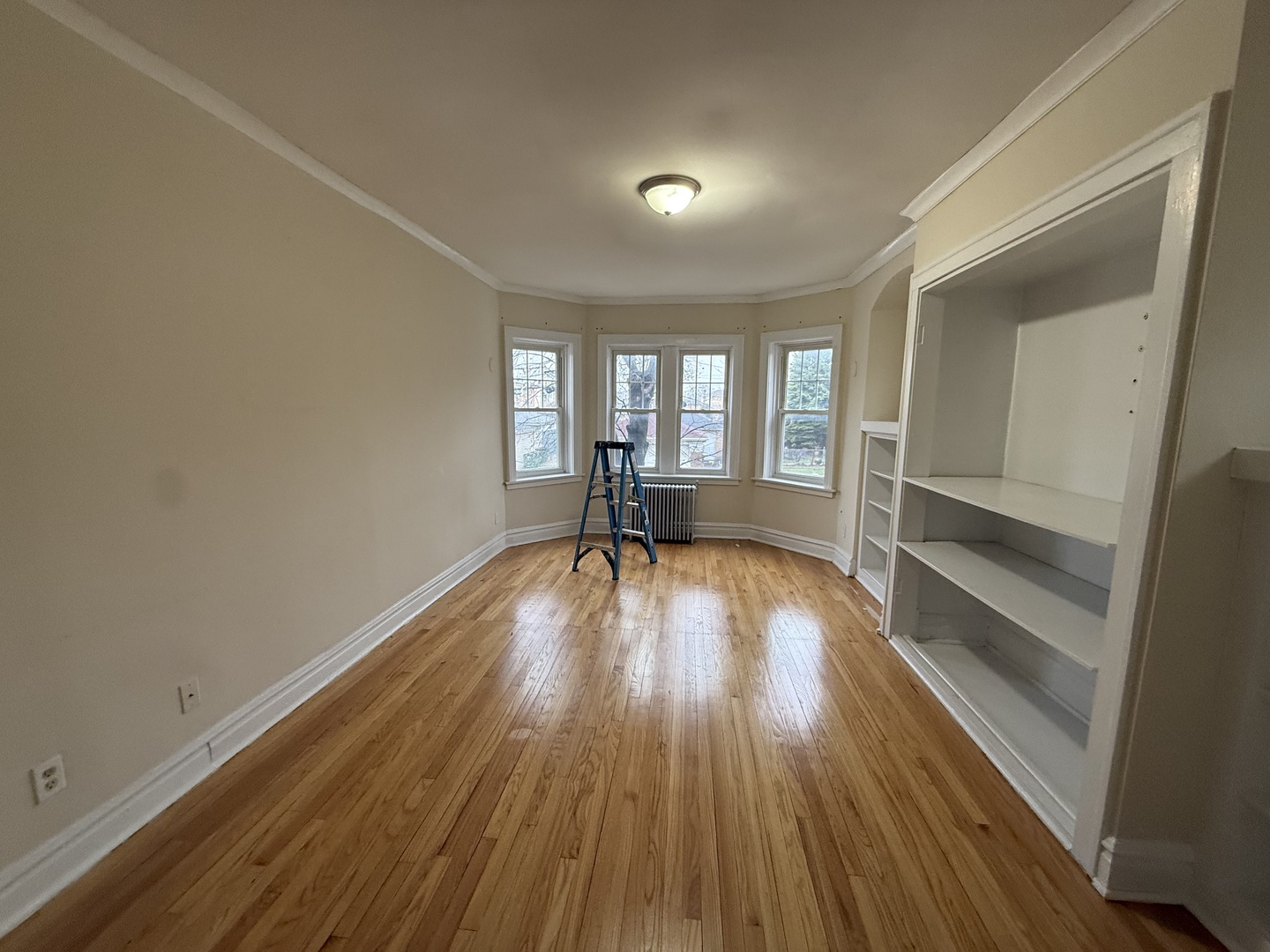 6839 21st Street, Unit 2N Berwyn, IL 60402 - Photo 5 of 12 wooden floor in an empty room with a window