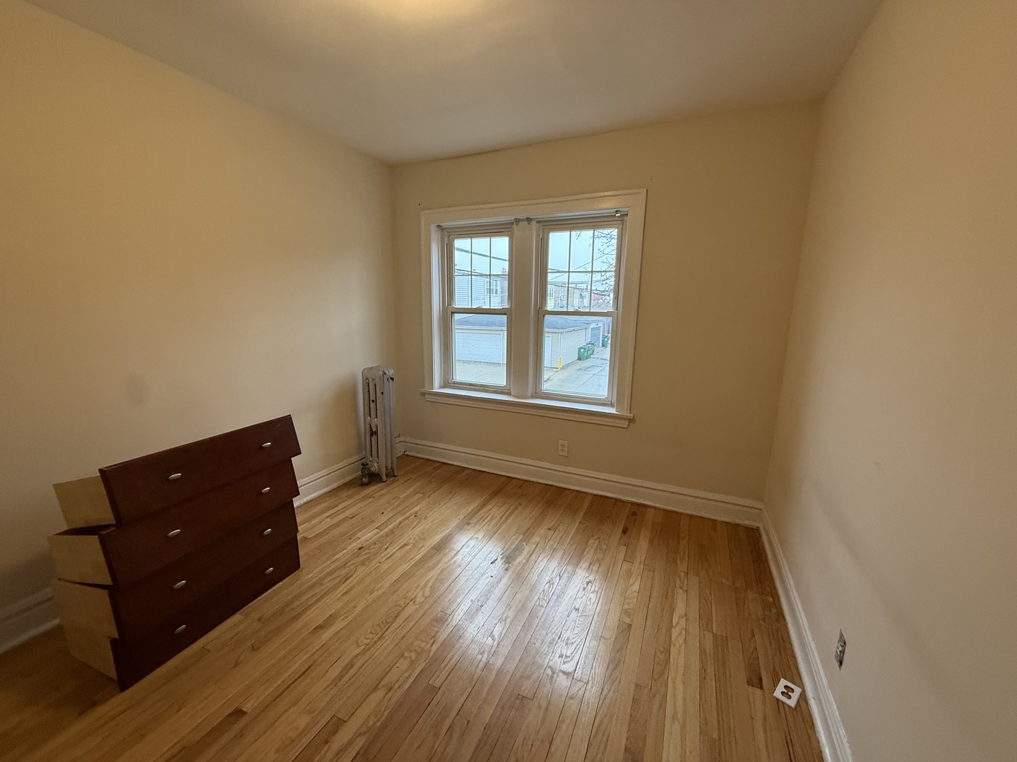 6839 21st Street, Unit 2N Berwyn, IL 60402 - Photo 6 of 12 an empty room with wooden floor and windows