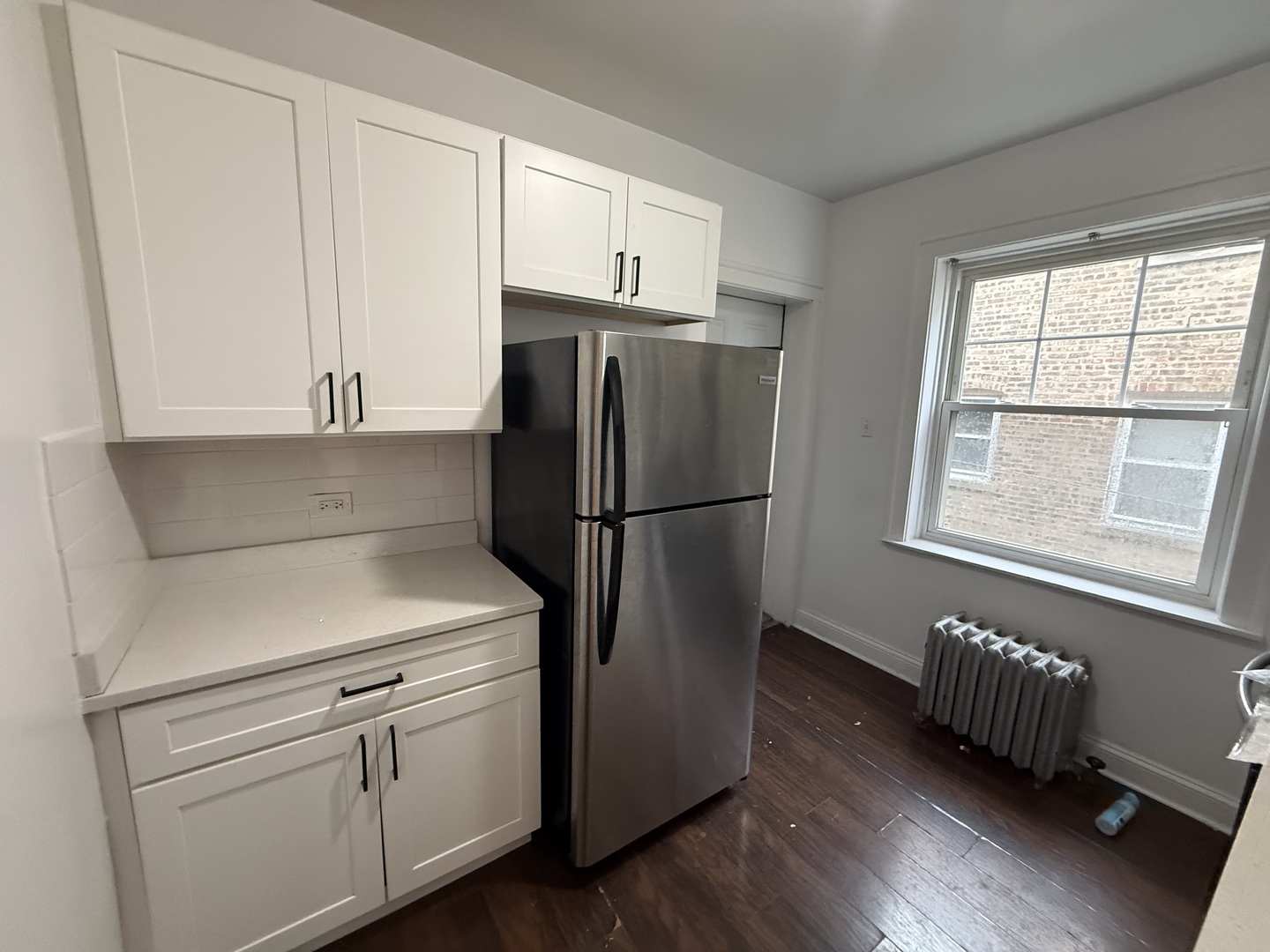 6839 21st Street, Unit 2N Berwyn, IL 60402 - Photo 9 of 12 a kitchen with stainless steel appliances a refrigerator sink and cabinets