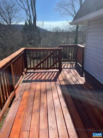 a balcony with wooden floor