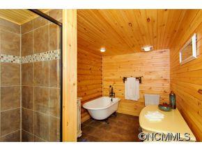 505 Howland Road Asheville, NC 28804 - Photo 17 of 24 a bathroom with a sink toilet and shower