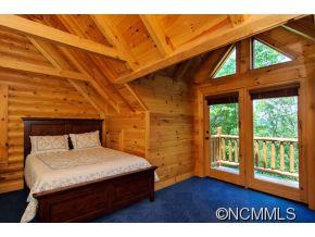 505 Howland Road Asheville, NC 28804 - Photo 18 of 24 a bedroom with a bed and a large window