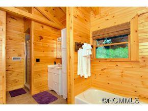 505 Howland Road Asheville, NC 28804 - Photo 20 of 24 a view of a bathroom with a tub and shower