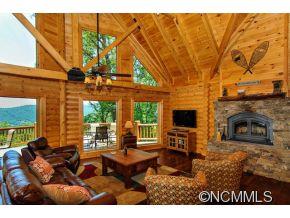 505 Howland Road Asheville, NC 28804 - Photo 8 of 24 a living room with furniture a fireplace and a flat screen tv