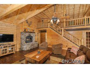 505 Howland Road Asheville, NC 28804 - Photo 9 of 24 a view of a livingroom with wooden floor and a fireplace