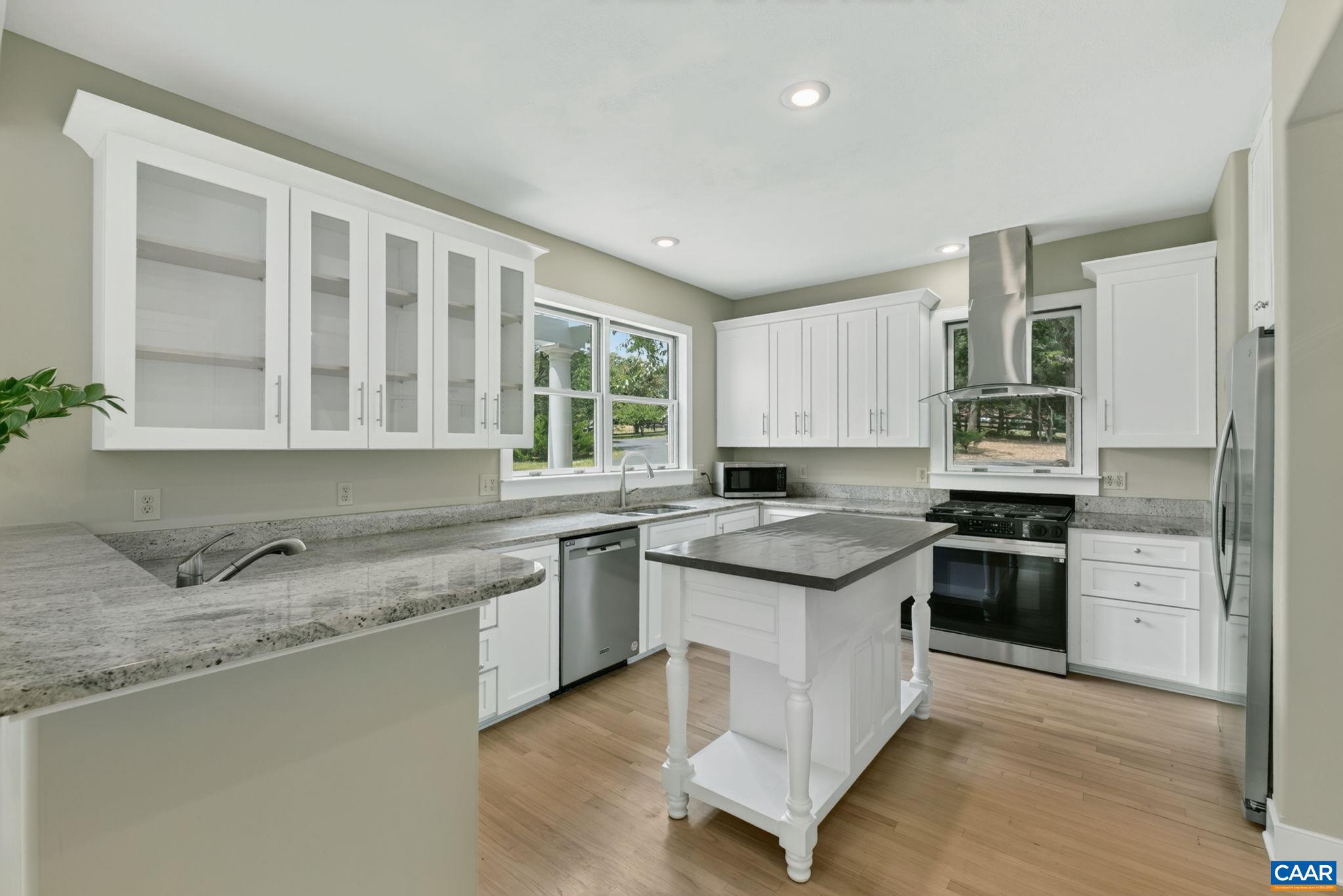 6285 Jarmans Gap Road Crozet, VA 22932 - Photo 4 of 65 a kitchen with granite countertop stainless steel appliances and sink