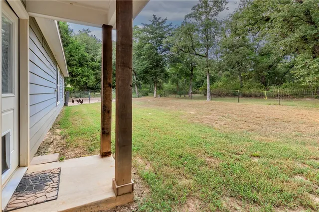 a view of a yard from a balcony