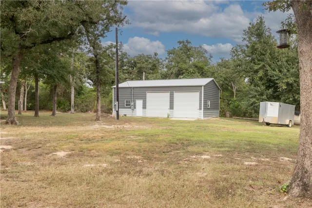 a house with trees in front of it