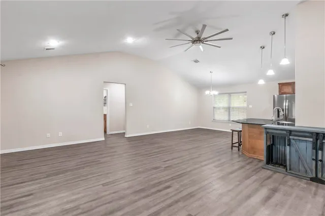 a view of a kitchen with a sink and microwave