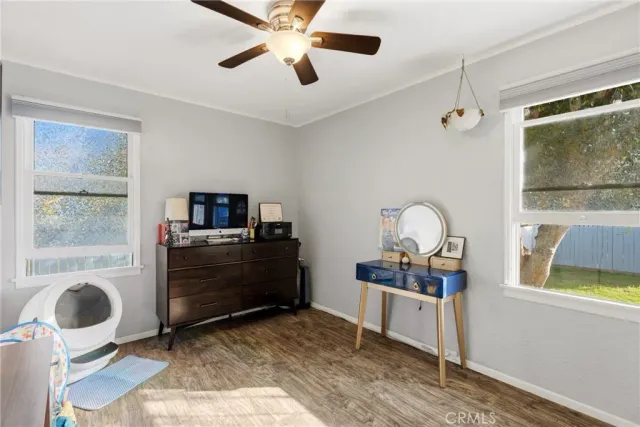 a bedroom with furniture and a window