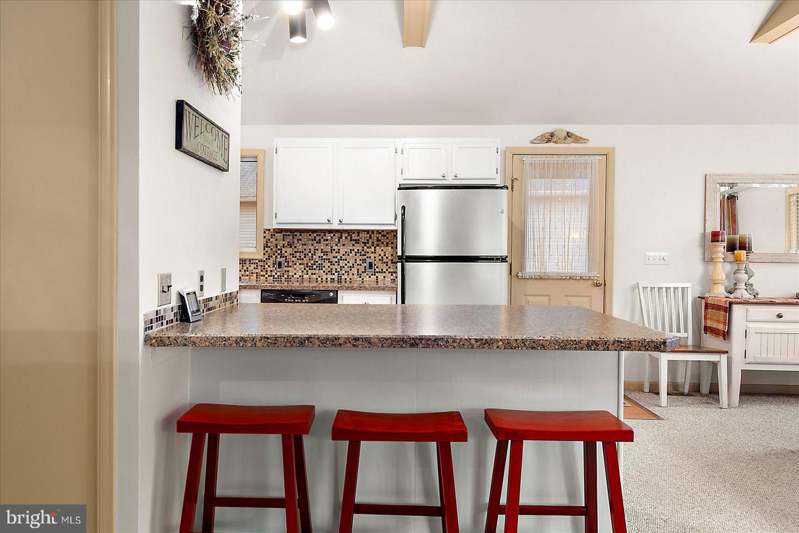 10 Harpoon Road Ocean Pines, MD 21811 - Photo 13 of 44 a kitchen with a table and chairs