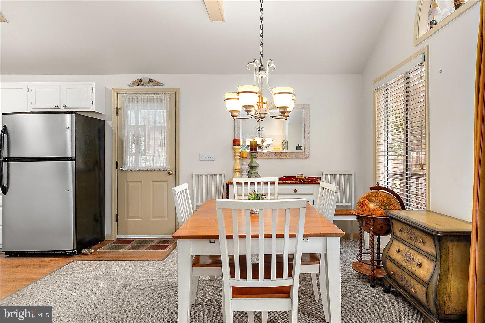 10 Harpoon Road Ocean Pines, MD 21811 - Photo 17 of 44 a bedroom with furniture a window and a chandelier