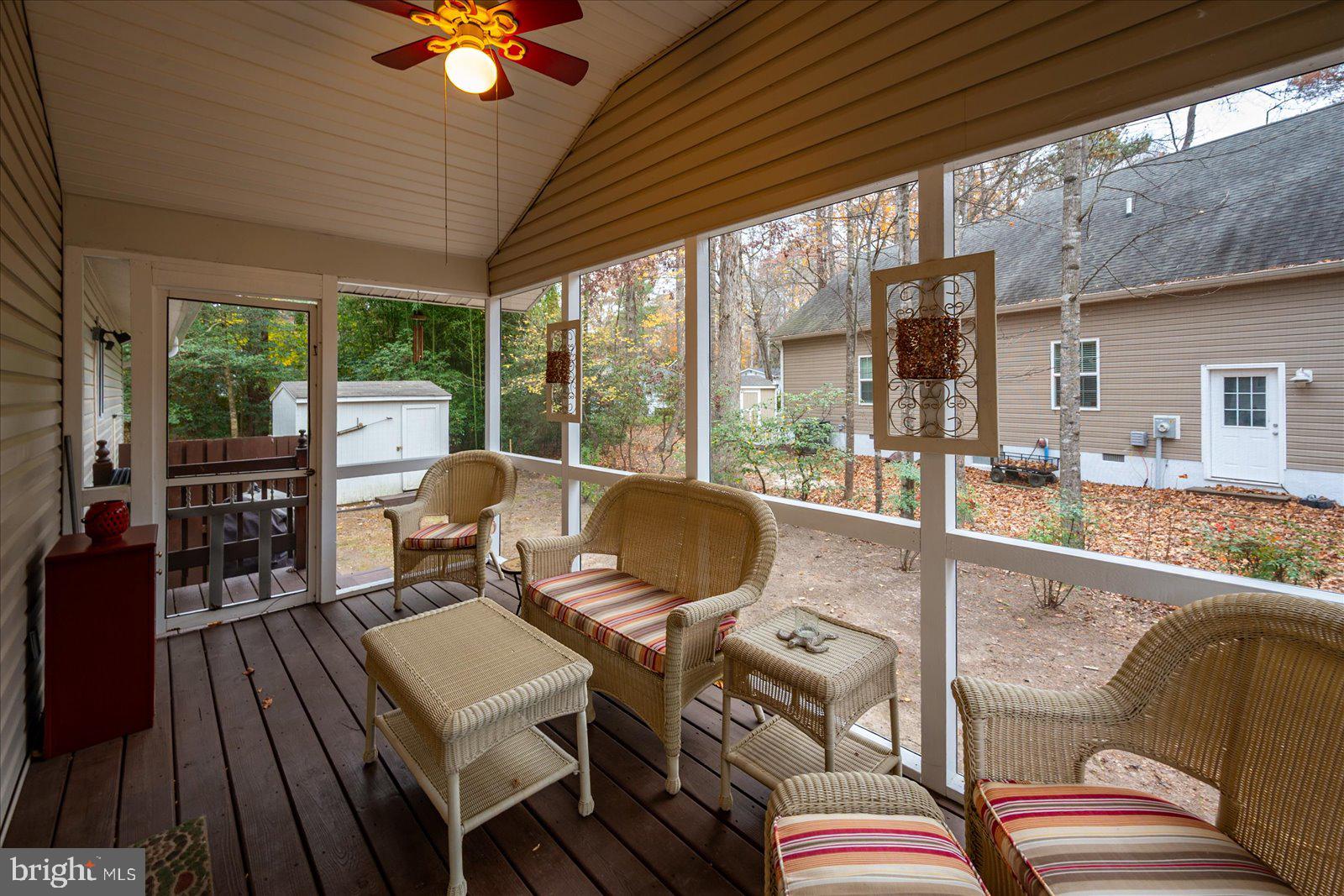 10 Harpoon Road Ocean Pines, MD 21811 - Photo 21 of 44 a living room with furniture and a floor to ceiling window