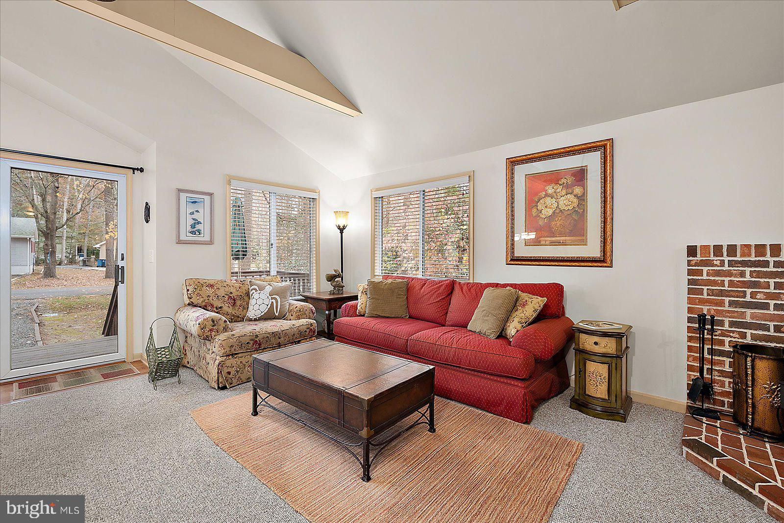 10 Harpoon Road Ocean Pines, MD 21811 - Photo 8 of 44 a living room with furniture a lamp and a window
