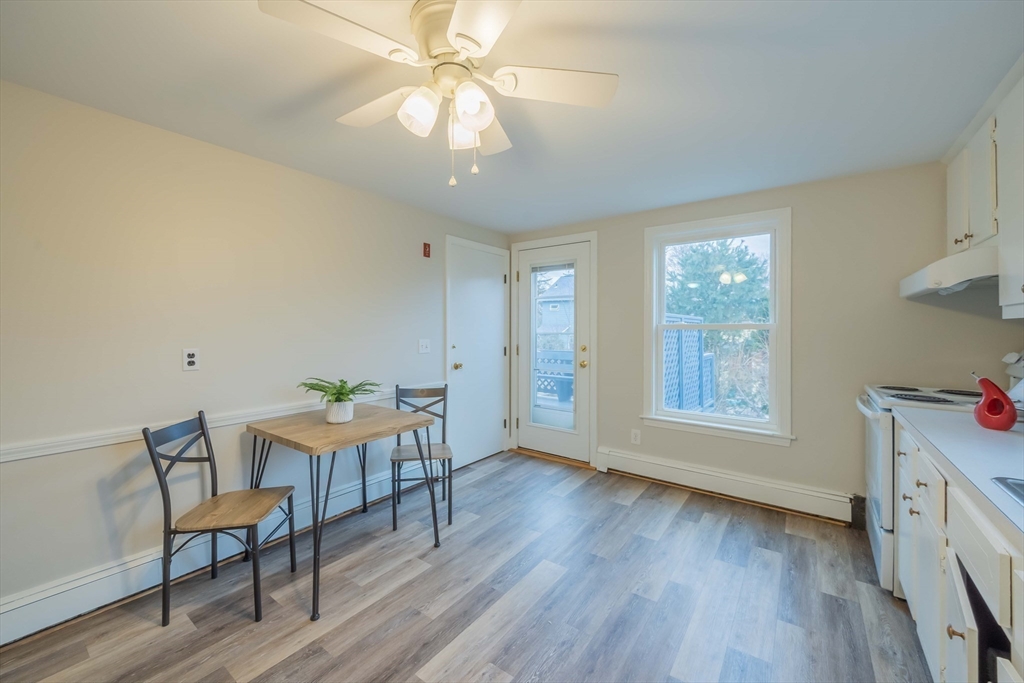 55 Sutherland Road, Unit 55 Arlington, MA 02476 - Photo 14 of 23 a view of a room with furniture window and wooden floor
