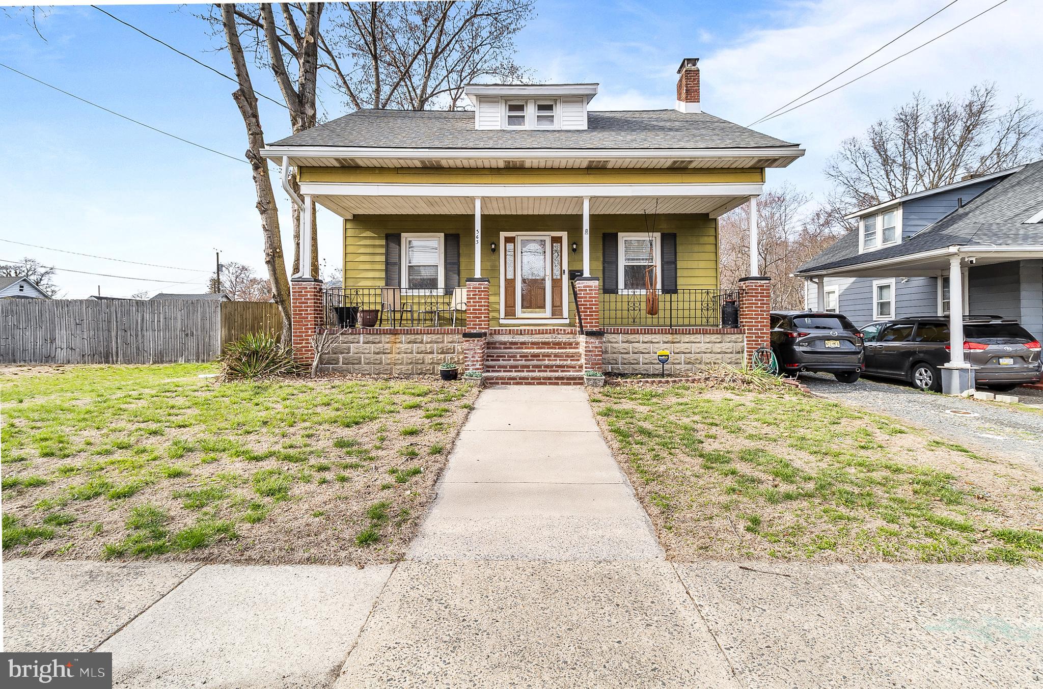 363 Washington Street Mount Holly, NJ 08060 - Photo 1 of 23 a front view of a house with a yard