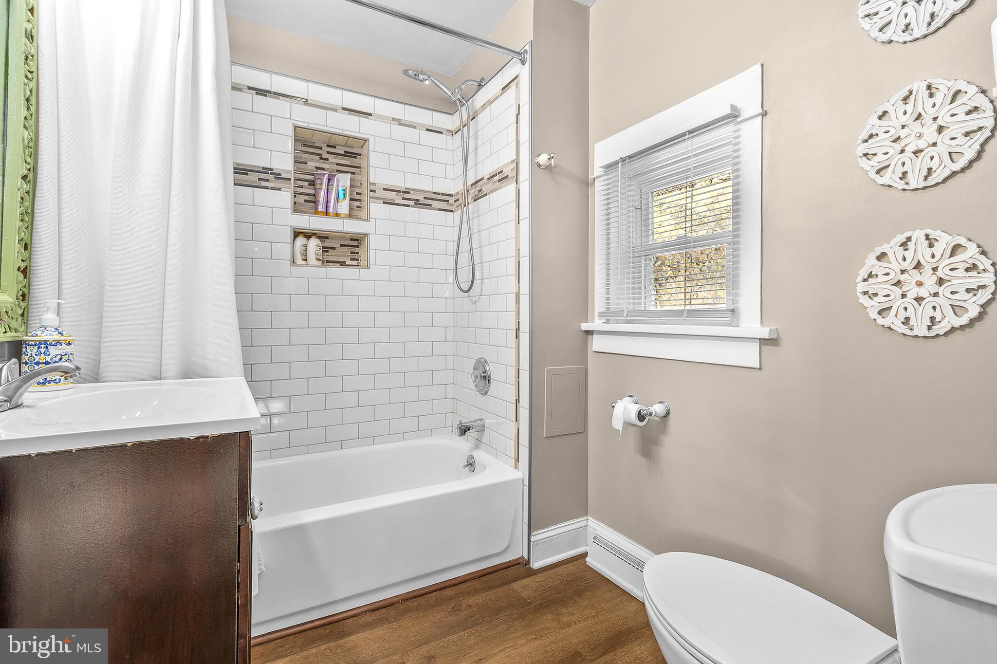 363 Washington Street Mount Holly, NJ 08060 - Photo 11 of 23 a bathroom with a sink a toilet and shower