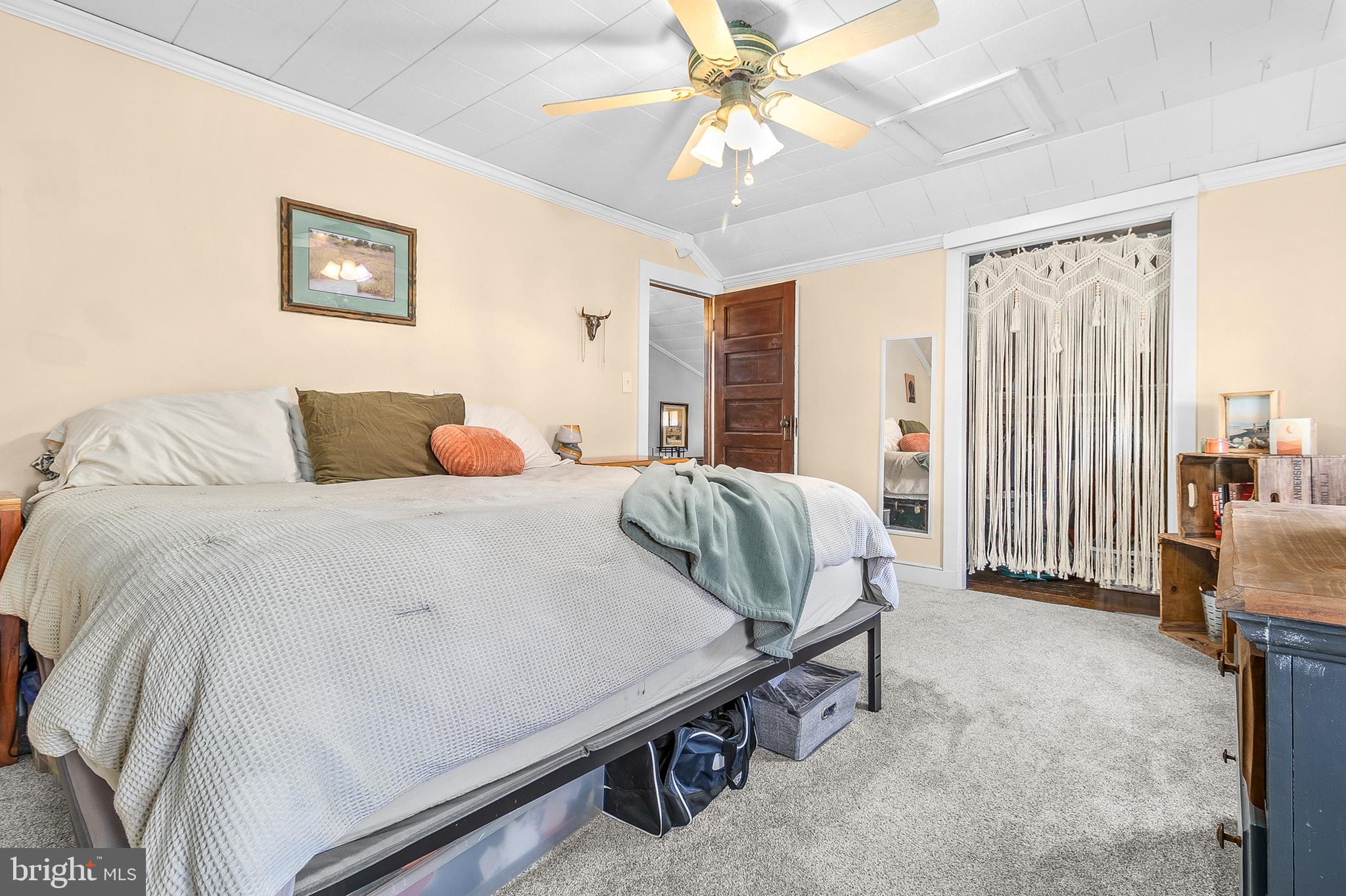 363 Washington Street Mount Holly, NJ 08060 - Photo 18 of 23 a bedroom with a large bed and a chandelier