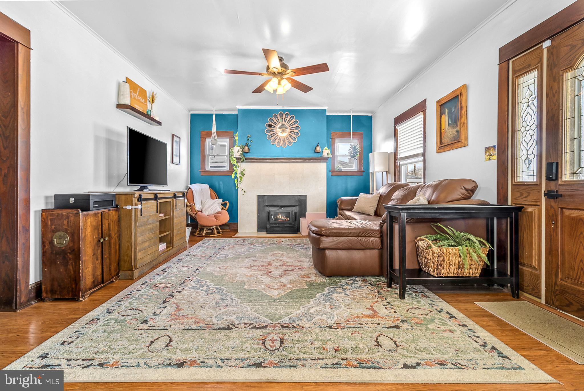 363 Washington Street Mount Holly, NJ 08060 - Photo 4 of 23 a living room with furniture and a fireplace
