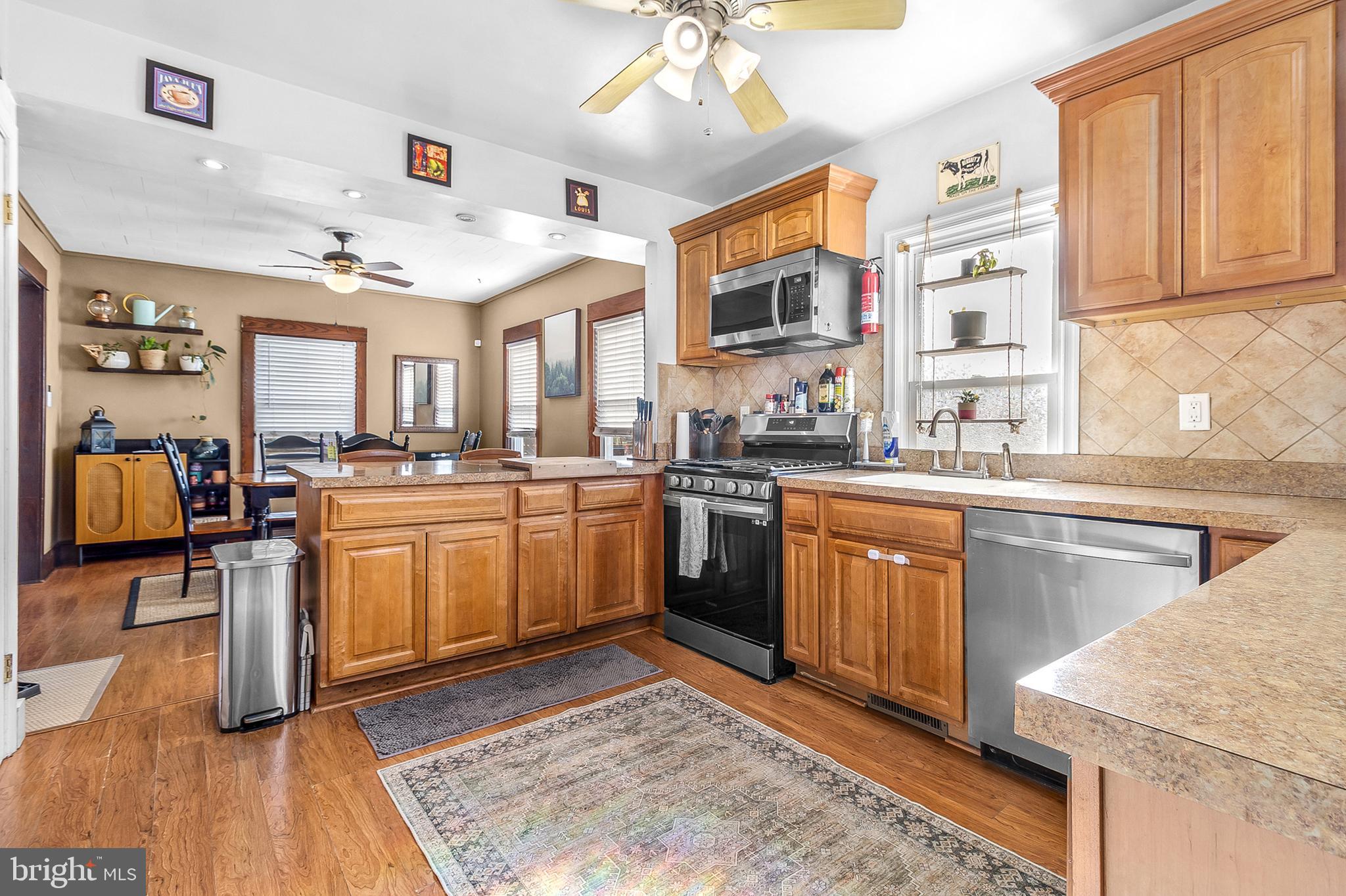 363 Washington Street Mount Holly, NJ 08060 - Photo 8 of 23 a kitchen with a sink stove and cabinets