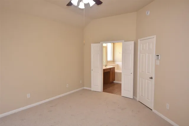 wooden floor in an empty room and a kitchen
