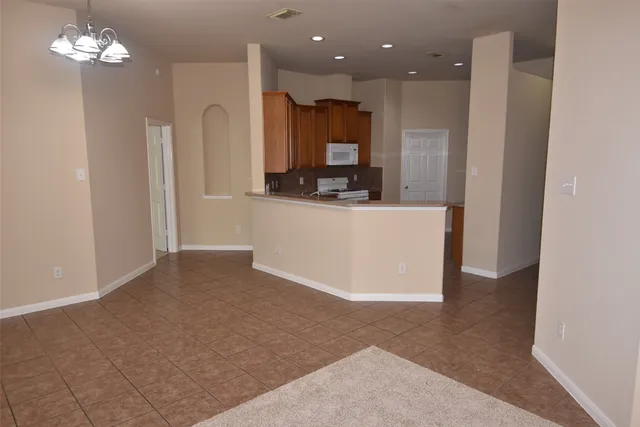 a view of kitchen with refrigerator sink and microwave