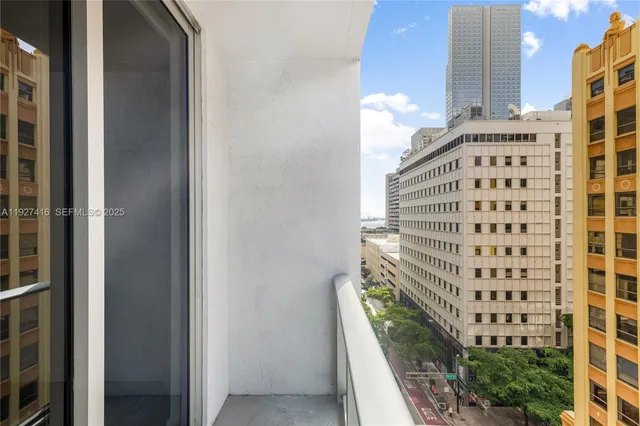 a view of balcony with wooden floor