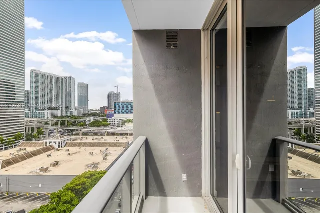 a view of a kitchen from a hallway