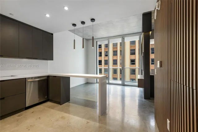 a view of a kitchen with a sink and cabinets