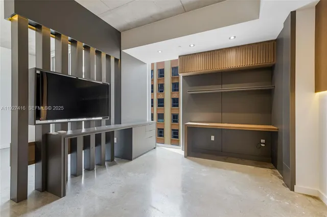 a room with furniture and a flat screen tv