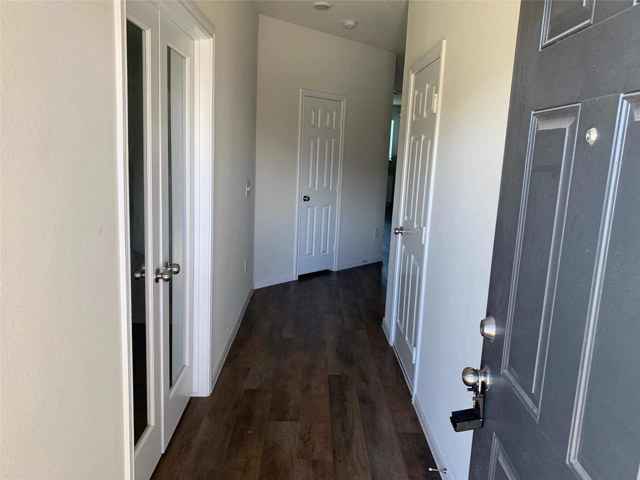 4622 Falling Sun Drive Houston, TX 77069 - Photo 2 of 28 a view of a hallway with wooden floor and staircase