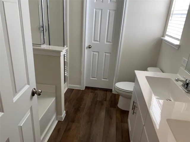 a bathroom with a sink and toilet