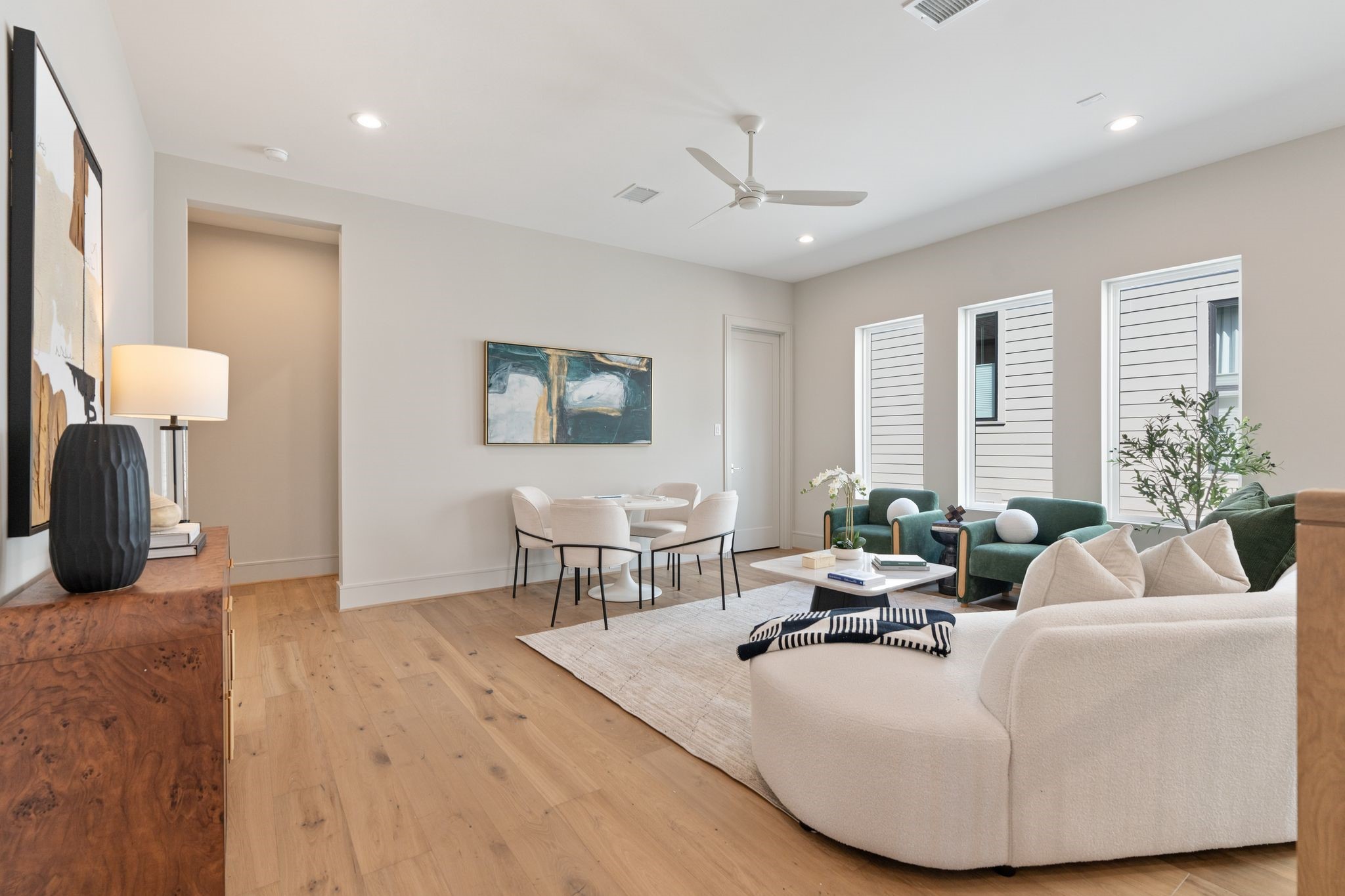 711 East 12th Street Houston, TX 77008 - Photo 27 of 47 Abundant windows bring in natural light, while warm hardwood floors carry the home’s inviting style.