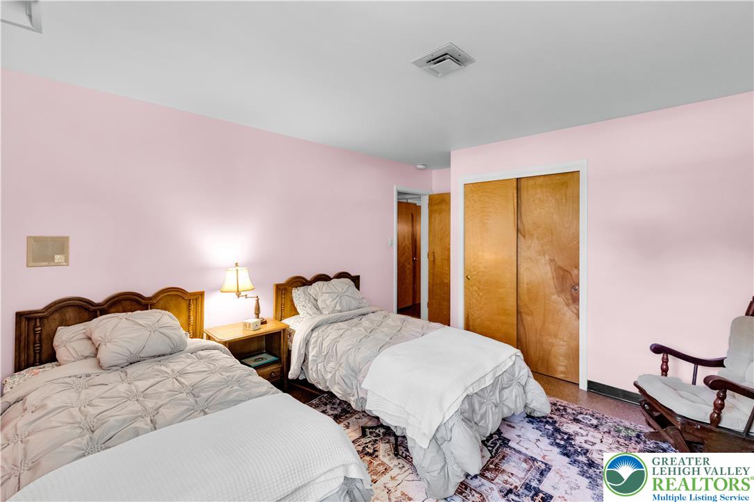 5747 Kernsville Road Orefield, PA 18069 - Photo 31 of 56 a bedroom with two beds and painting on the wall