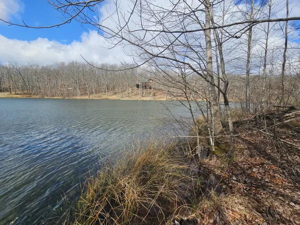a view of outdoor space with wooden fence