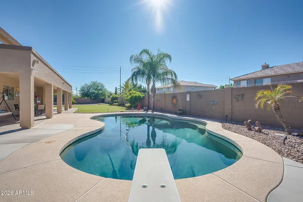 a view of a swimming pool with a patio