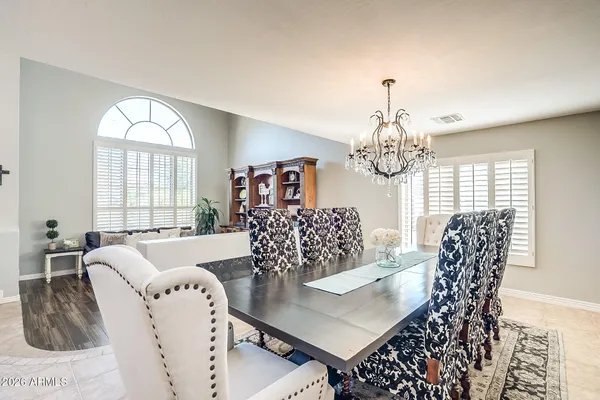 a view of a dining room with furniture and window