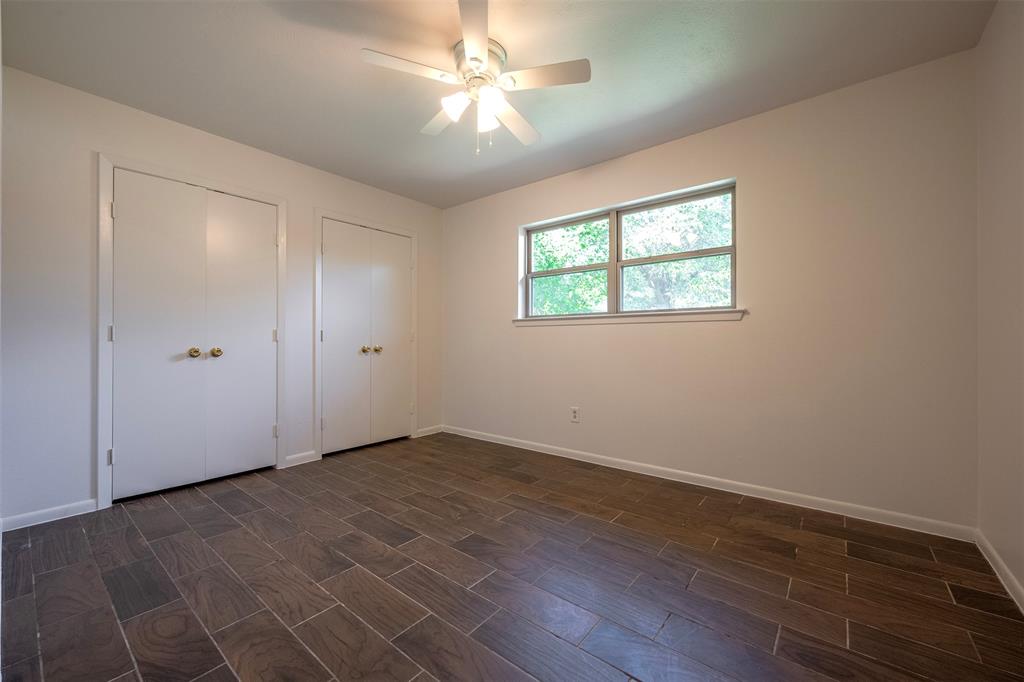 610 East Anderson Street Weatherford, TX 76086 - Photo 15 of 25 wooden floor in an empty room with a window