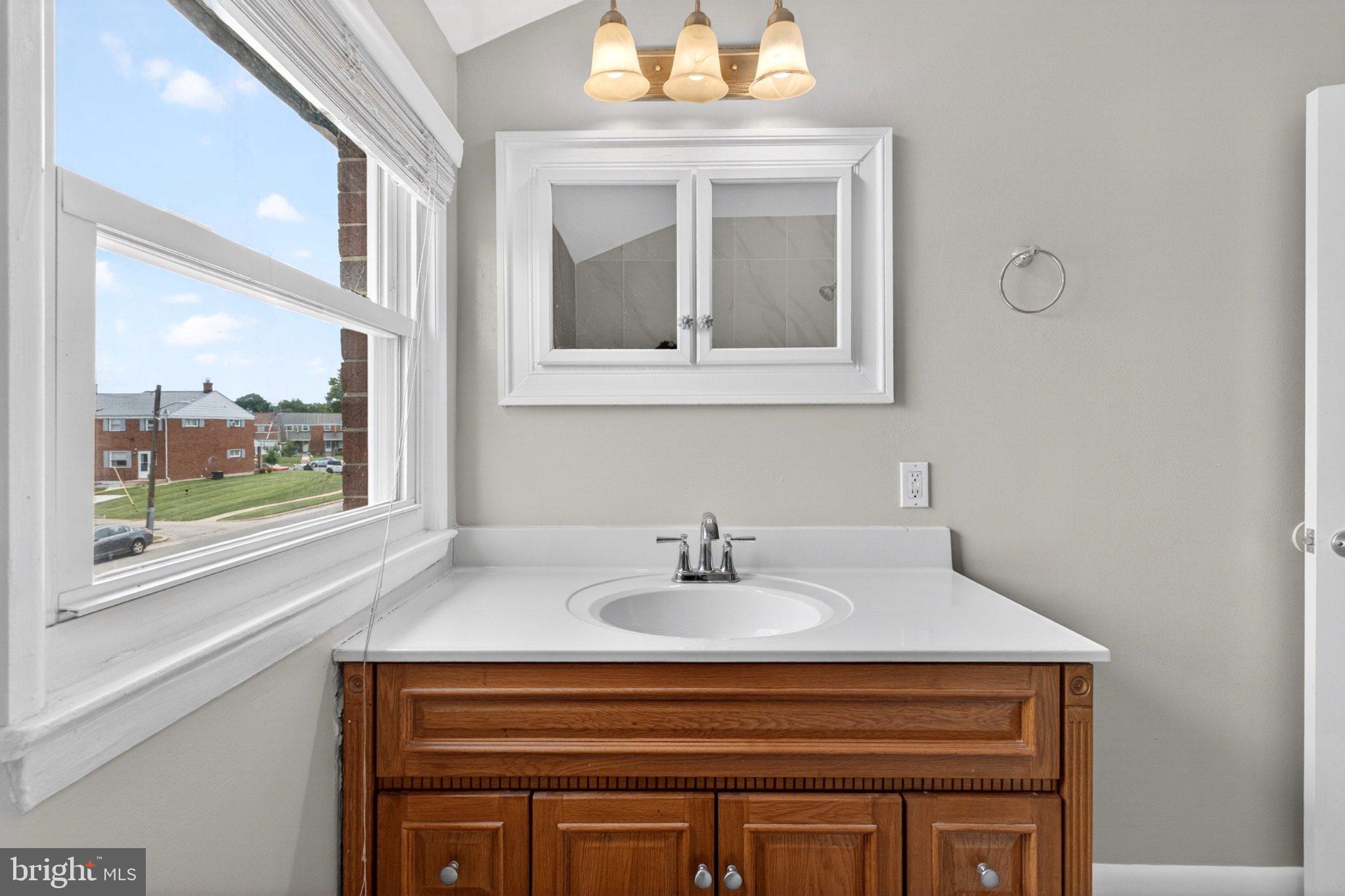 7729 Charlesmont Road Baltimore, MD 21222 - Photo 28 of 38 Bright and airy bathroom retreat.