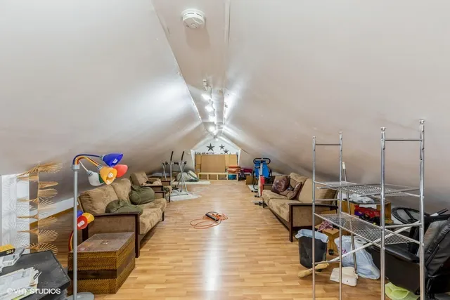 a living room with lots of furniture and white walls
