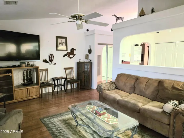 a large bed sitting in a bedroom next to a window