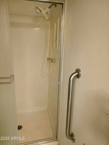 a bathroom with a sink mirror and a bathtub