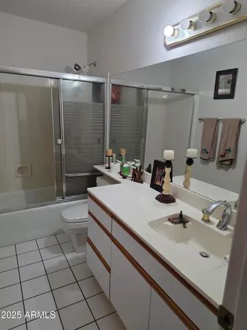 a bedroom with bed and window