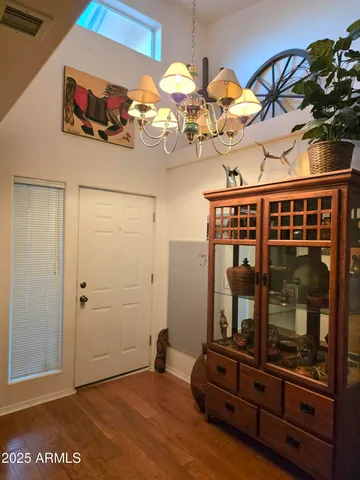 a kitchen with granite countertop a refrigerator and a stove top oven