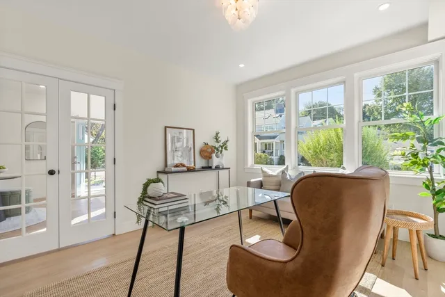 a view of an entryway with wooden floor