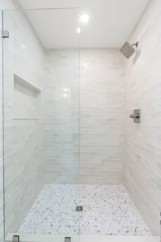 a bedroom with a large bed and a couch