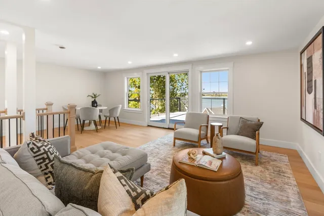 a view of a livingroom with furniture and a window